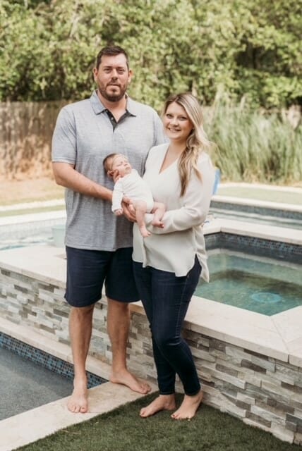 The Pool Butler family by the pool with baby